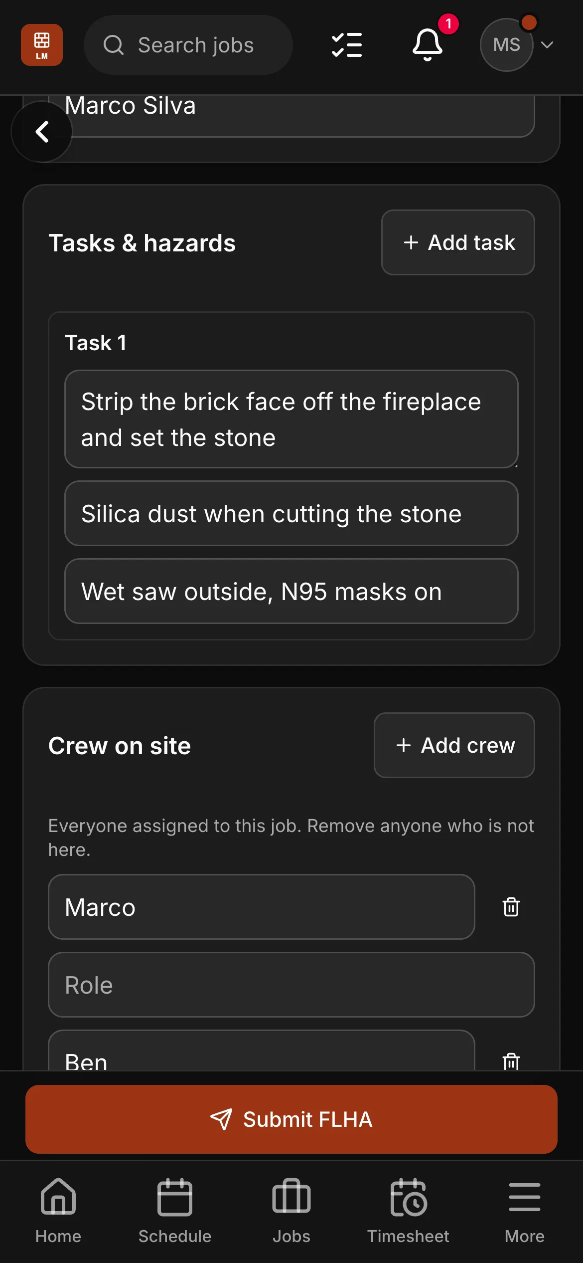 An FLHA on Marco’s phone for the fireplace job, “Strip the brick face off the fireplace and set the stone”: the task with its hazard and its control, and the crew on site under it.